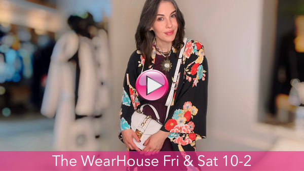 A stylish model showcasing a chic ensemble from The WearHouse, Albuquerque's premier women's consignment boutique, featuring a mix of high-quality clothing, accessories, and jewelry.