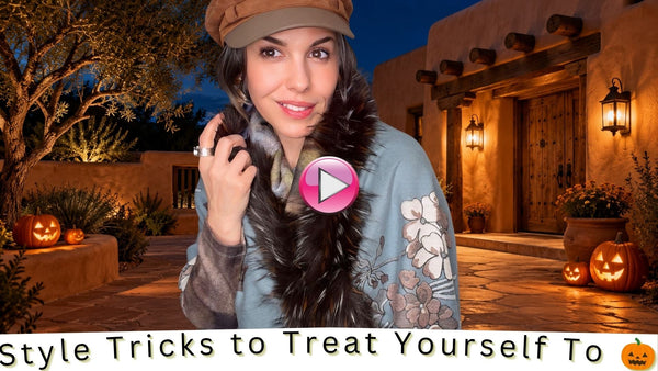 Woman modeling a floral jacket and faux-fur scarf in a glowing New Mexico courtyard decorated with jack-o’-lanterns.